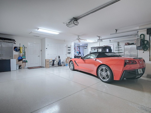 garage with ceiling fan and a garage door opener