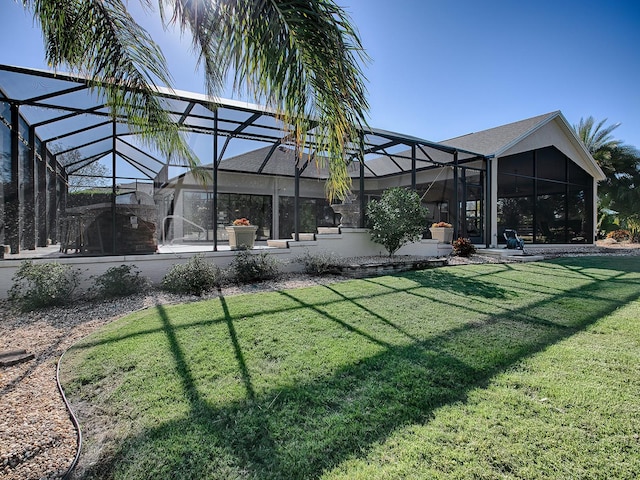 view of yard featuring glass enclosure