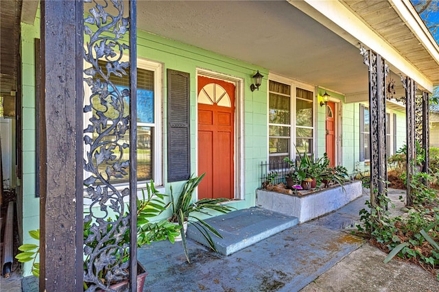 property entrance featuring covered porch