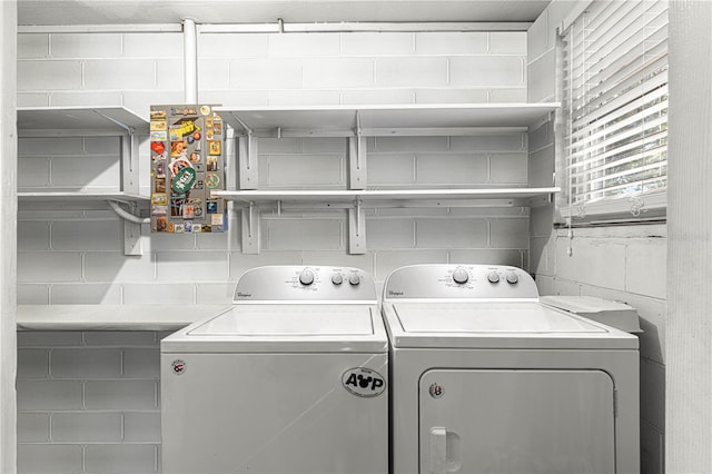 washroom with washing machine and dryer