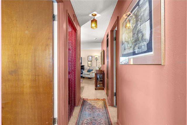 corridor with a textured ceiling