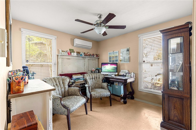 office space featuring an AC wall unit and ceiling fan