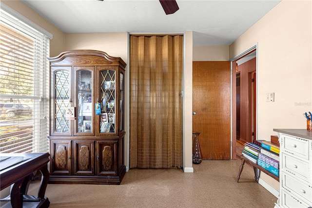 entrance foyer with ceiling fan