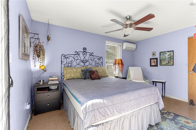 bedroom featuring a wall mounted air conditioner and ceiling fan