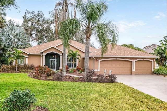 ranch-style home with a garage and a front yard