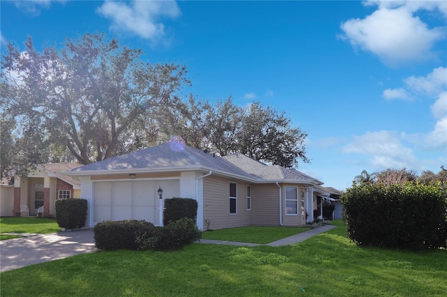 view of home's exterior with a lawn and a garage