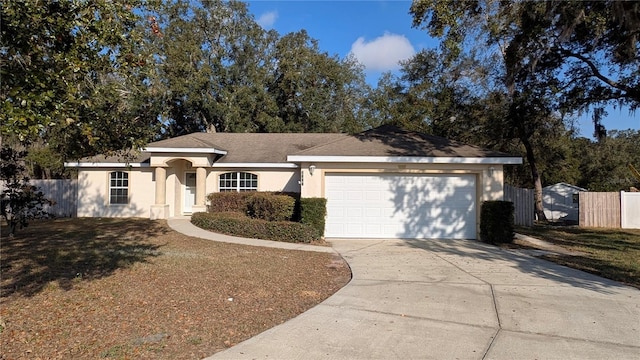 ranch-style house featuring concrete driveway, fence, a garage, and stucco siding