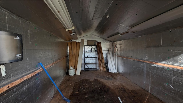 miscellaneous room with lofted ceiling