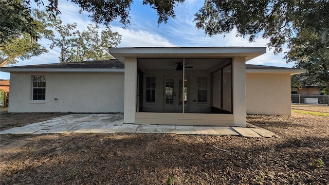 back of house with a sunroom, a patio, and ceiling fan