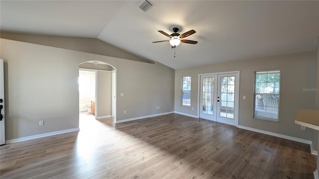 spare room featuring french doors, lofted ceiling, wood-type flooring, and ceiling fan