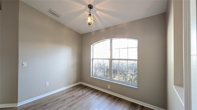 spare room featuring light hardwood / wood-style floors