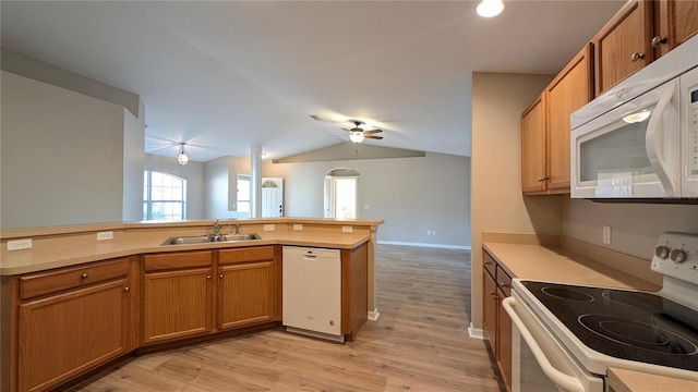 kitchen featuring lofted ceiling, sink, white appliances, ceiling fan, and light hardwood / wood-style floors