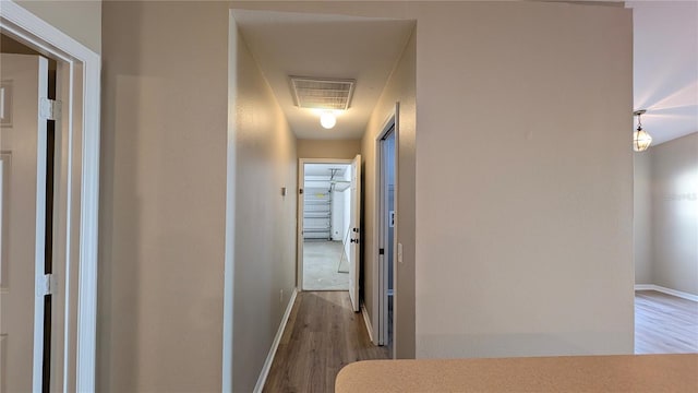 hall featuring wood-type flooring