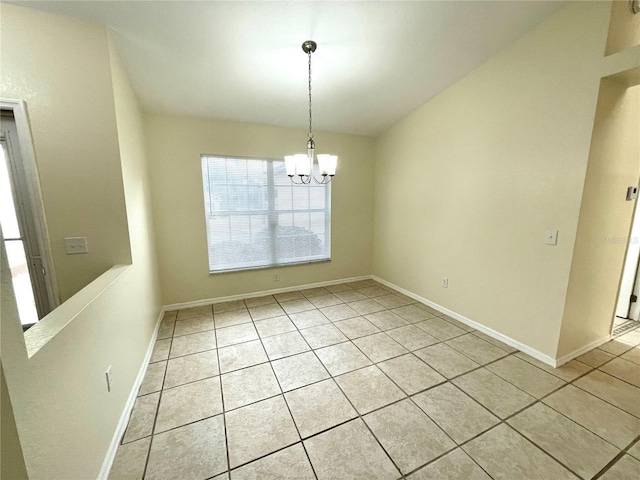 unfurnished dining area featuring a notable chandelier and light tile patterned flooring