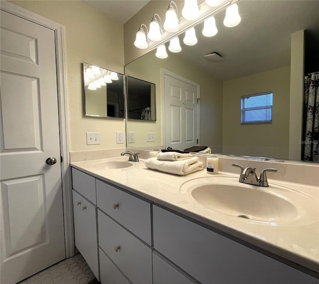 bathroom with tile patterned flooring and vanity