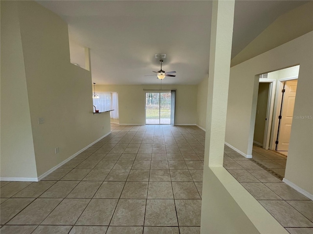 tiled spare room with ceiling fan and lofted ceiling