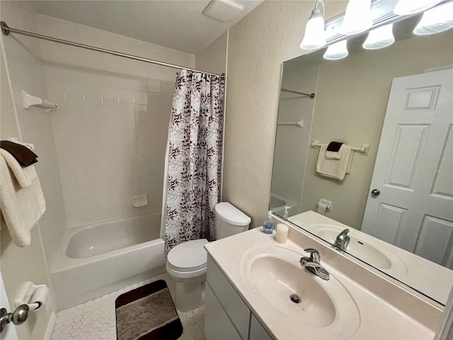 full bathroom with tile patterned floors, vanity, toilet, and shower / bath combo with shower curtain