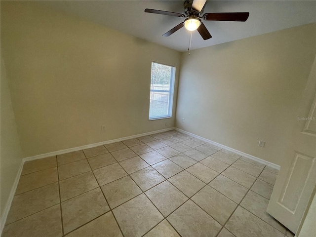 unfurnished room featuring ceiling fan and light tile patterned flooring