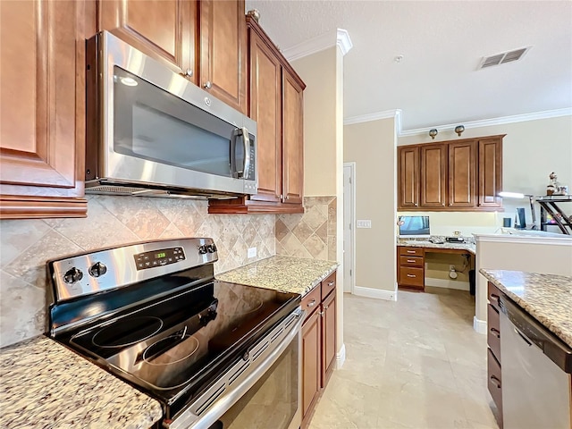 kitchen with appliances with stainless steel finishes, tasteful backsplash, light stone counters, and ornamental molding