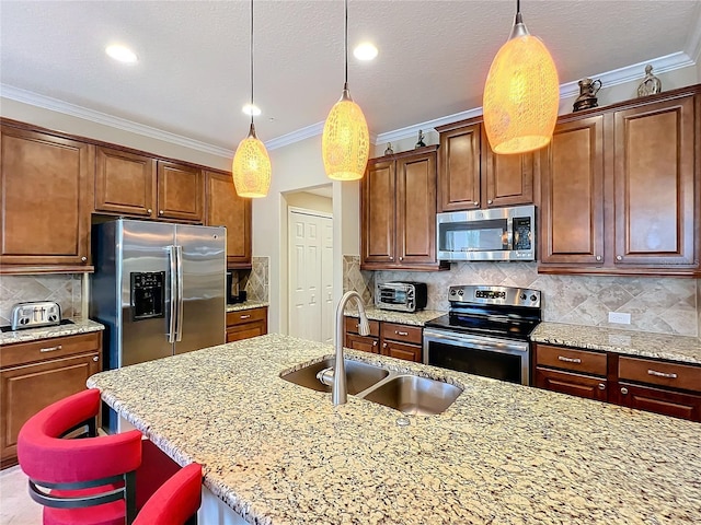 kitchen with decorative light fixtures, stainless steel appliances, crown molding, and sink