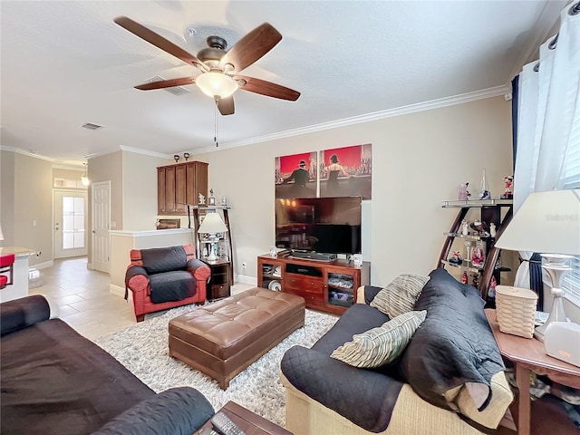 living room with ceiling fan, ornamental molding, and light tile patterned floors