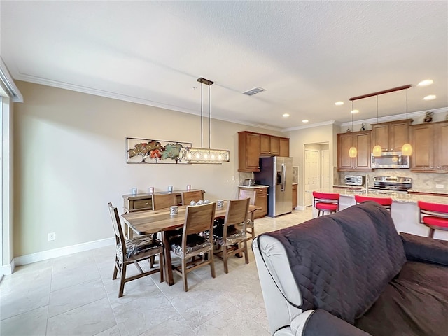 dining room featuring ornamental molding