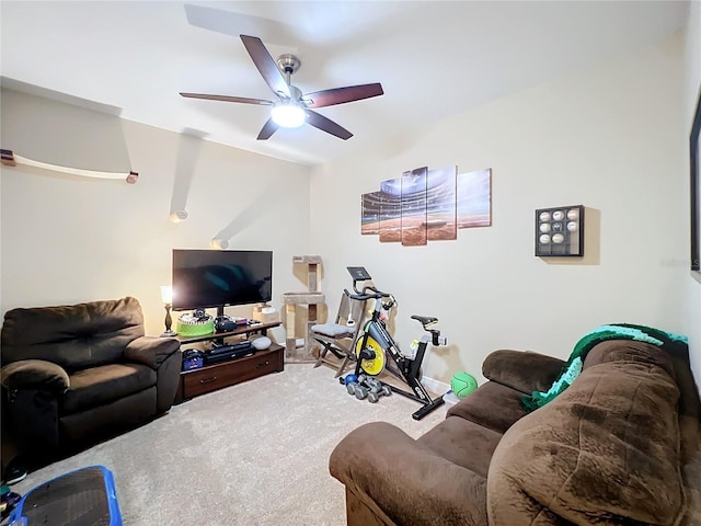 carpeted living room featuring ceiling fan