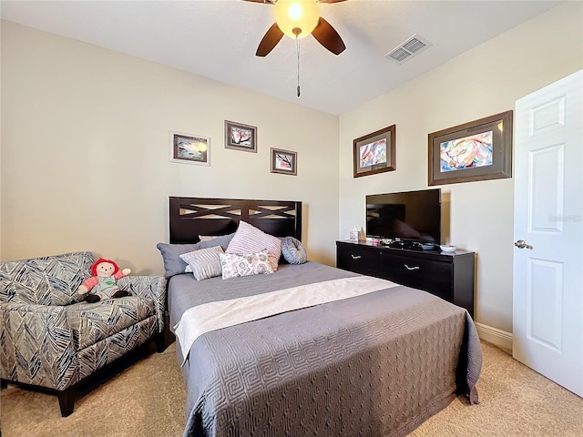 bedroom with light colored carpet and ceiling fan