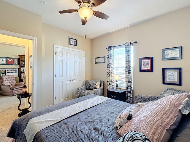 bedroom with carpet, a closet, and ceiling fan