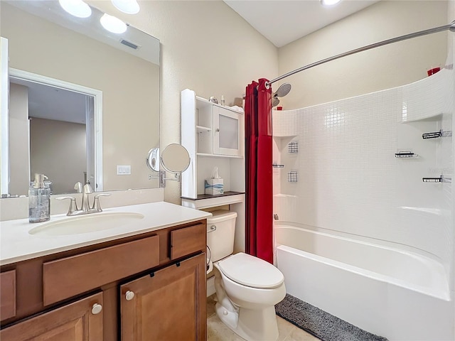 full bathroom with tile patterned flooring, vanity, shower / tub combo, and toilet