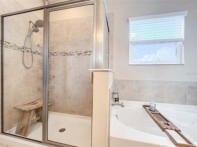 bathroom with plenty of natural light and plus walk in shower