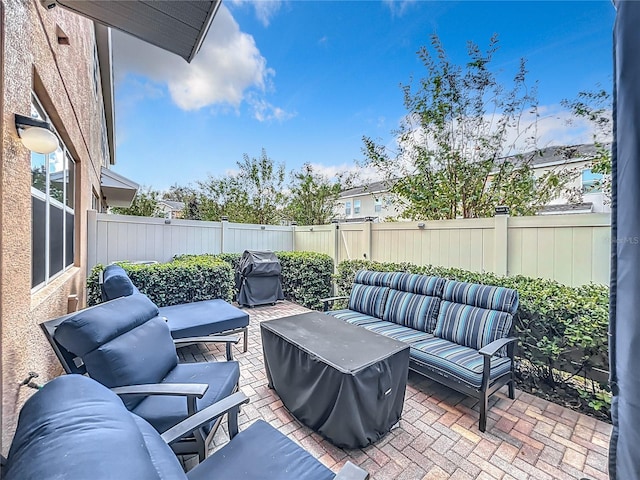 view of patio / terrace with outdoor lounge area and a grill