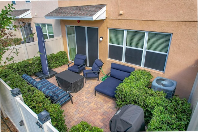 view of patio / terrace with an outdoor living space and central air condition unit