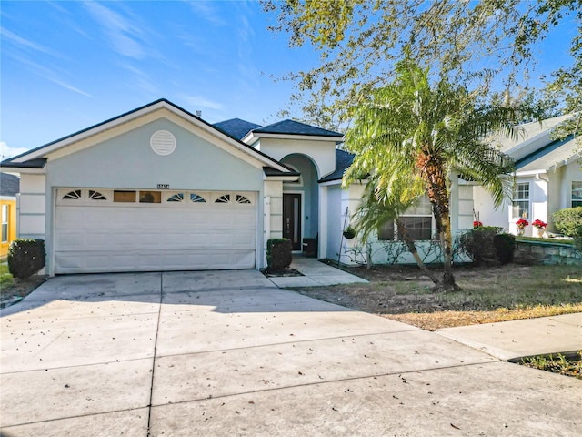 single story home featuring a garage