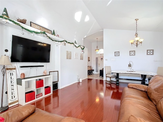 living room featuring hardwood / wood-style floors and an inviting chandelier