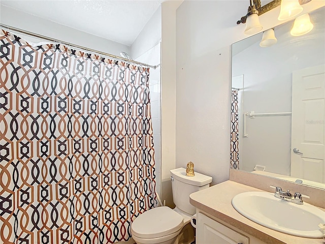 bathroom with a shower with shower curtain, vanity, and toilet