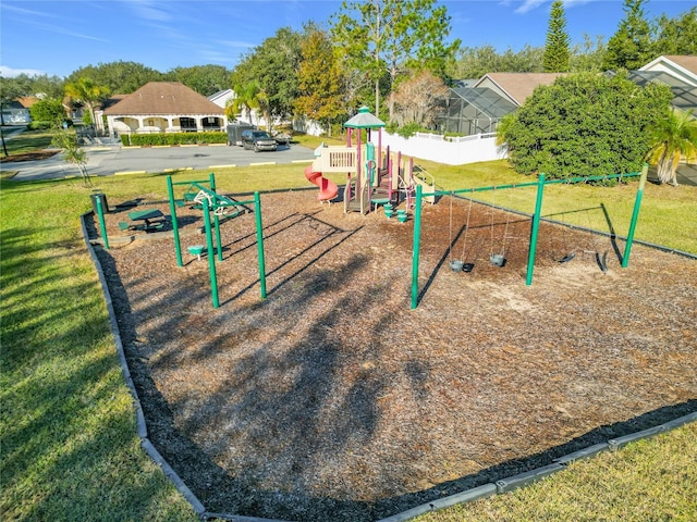 view of community with a yard and a playground