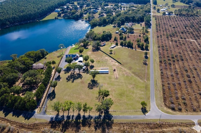 birds eye view of property with a rural view and a water view