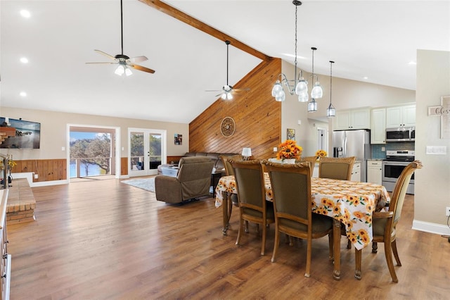 dining room featuring ceiling fan, beamed ceiling, high vaulted ceiling, and hardwood / wood-style floors