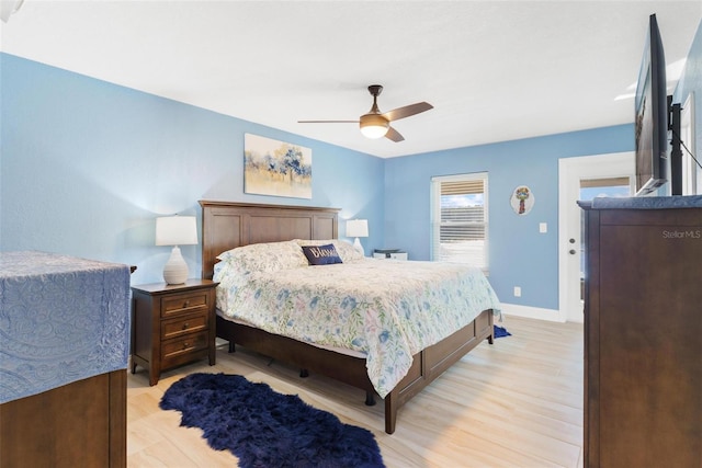 bedroom featuring ceiling fan and light hardwood / wood-style floors