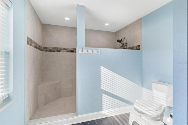 bathroom with a tile shower