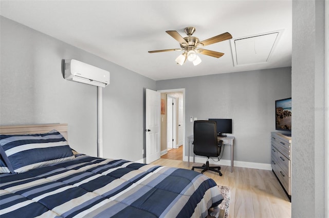 bedroom featuring a wall mounted AC, ceiling fan, and light hardwood / wood-style flooring