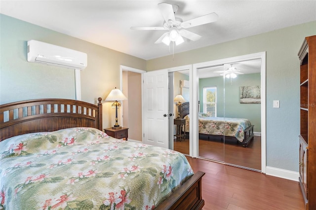 bedroom with ceiling fan, dark hardwood / wood-style floors, and a wall unit AC