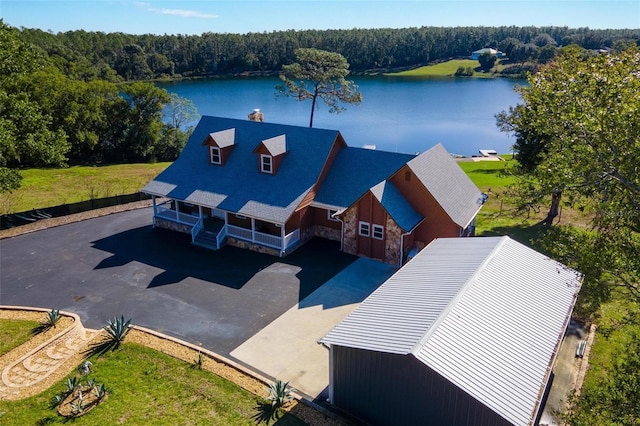 birds eye view of property with a water view