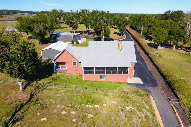 birds eye view of property with a rural view