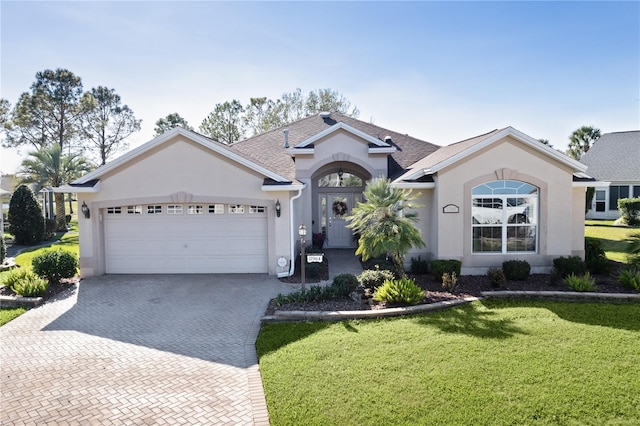 ranch-style house with a front lawn and a garage