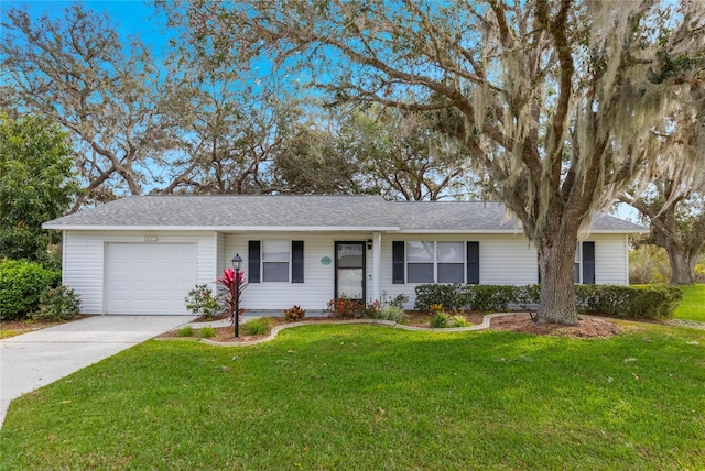 single story home with a garage and a front yard