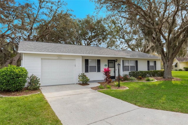 ranch-style house with a garage and a front lawn