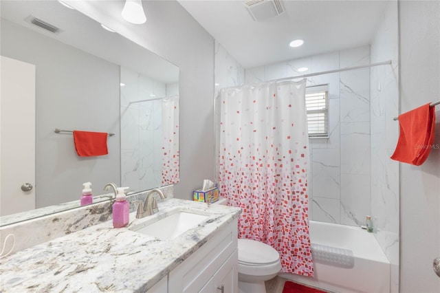 full bathroom with shower / tub combo, vanity, and toilet