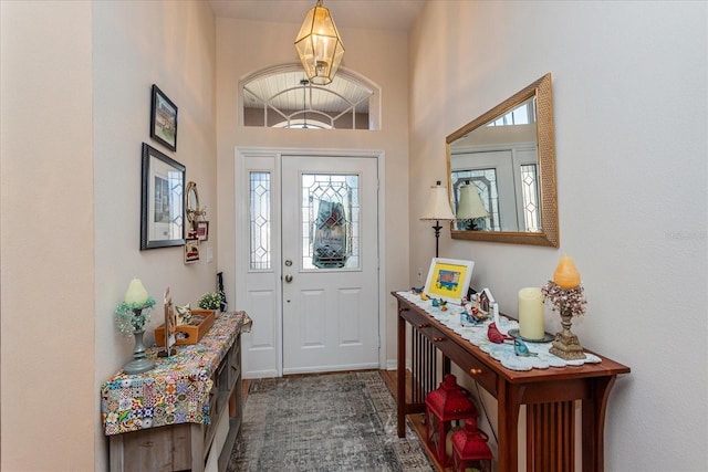 foyer entrance featuring a high ceiling